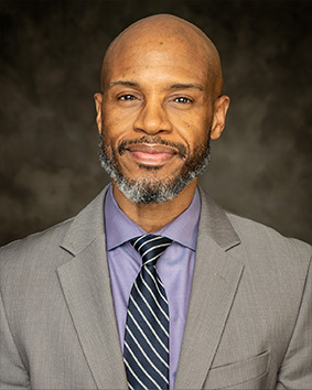 Headshot of Dr. Claude Hawkins